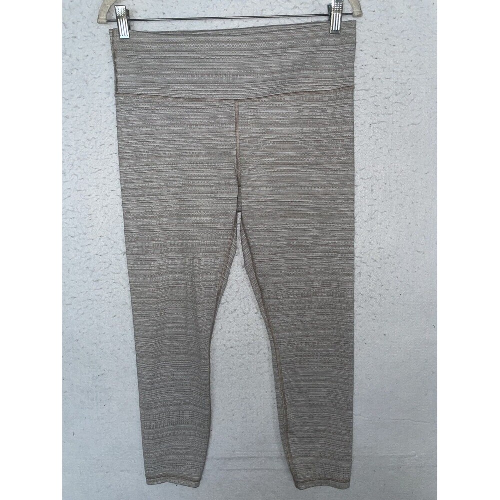Athleta Women’s High Rise Jacquard Chaturanga 7/8 Tights sz L Beige Cropped